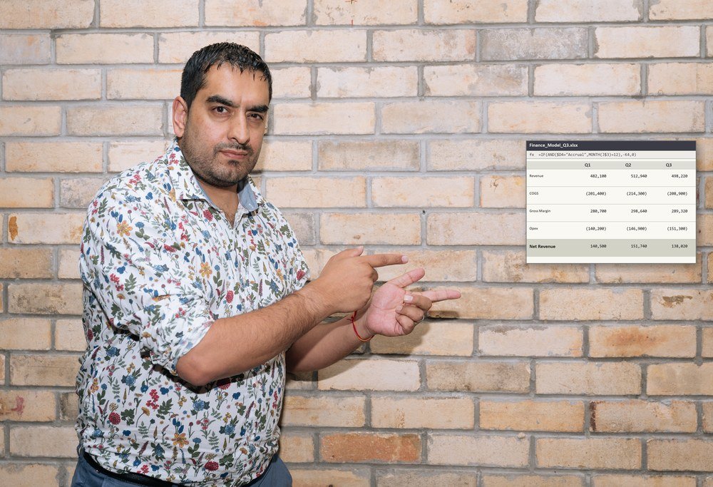 Rishi Sapra pointing to a finance spreadsheet model